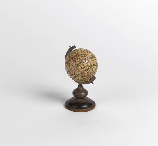 (GLOBE.) Fine miniature ivory terrestrial globe.